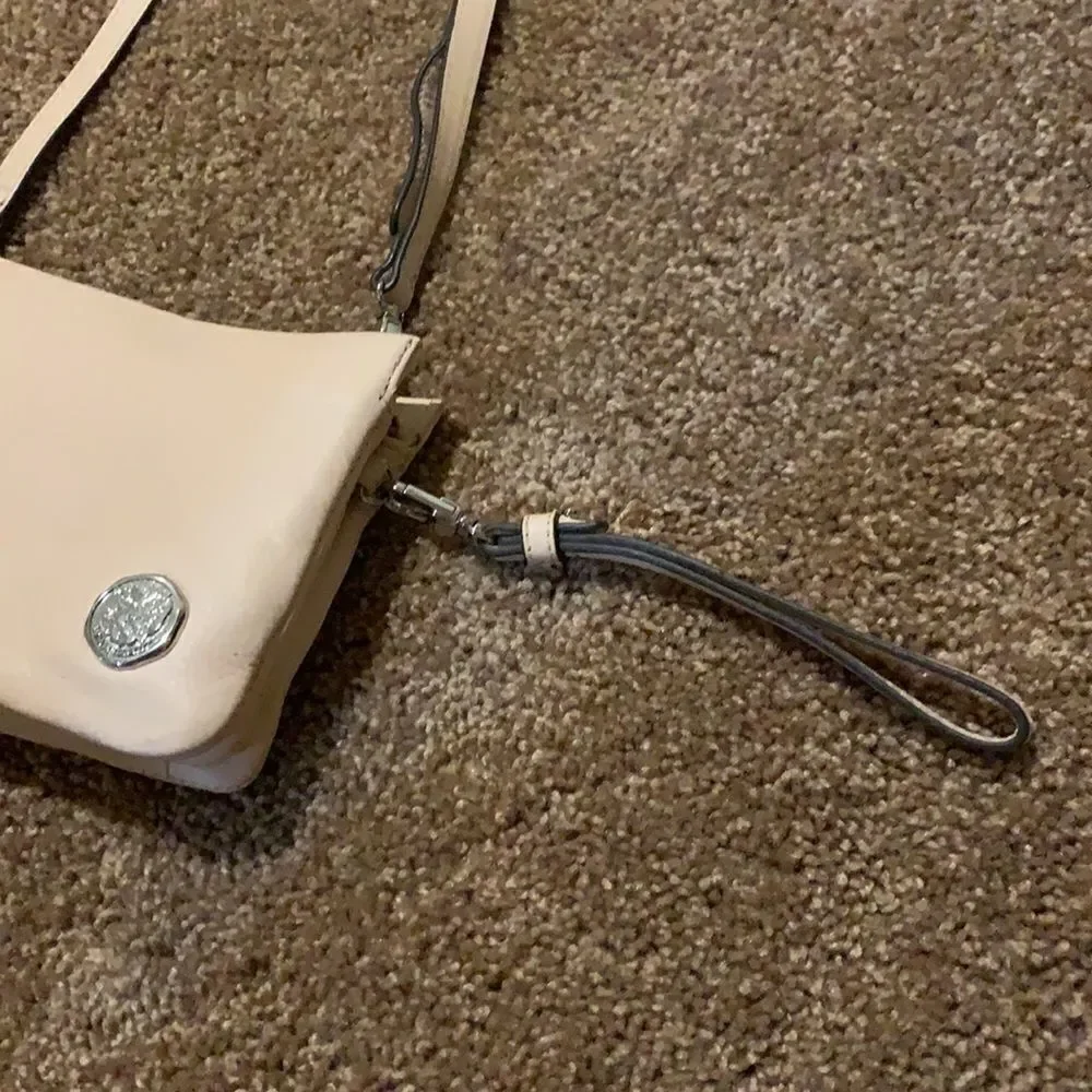 Vince Camuto soft pink crossbody wristlet.